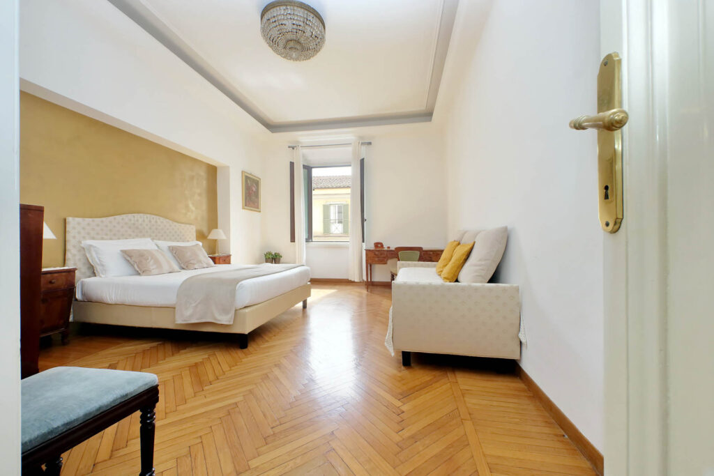 Picture of a minimalistic italian white bedroom with parquet floors in rome